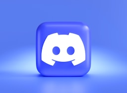 a square button with a smiley face on a blue background