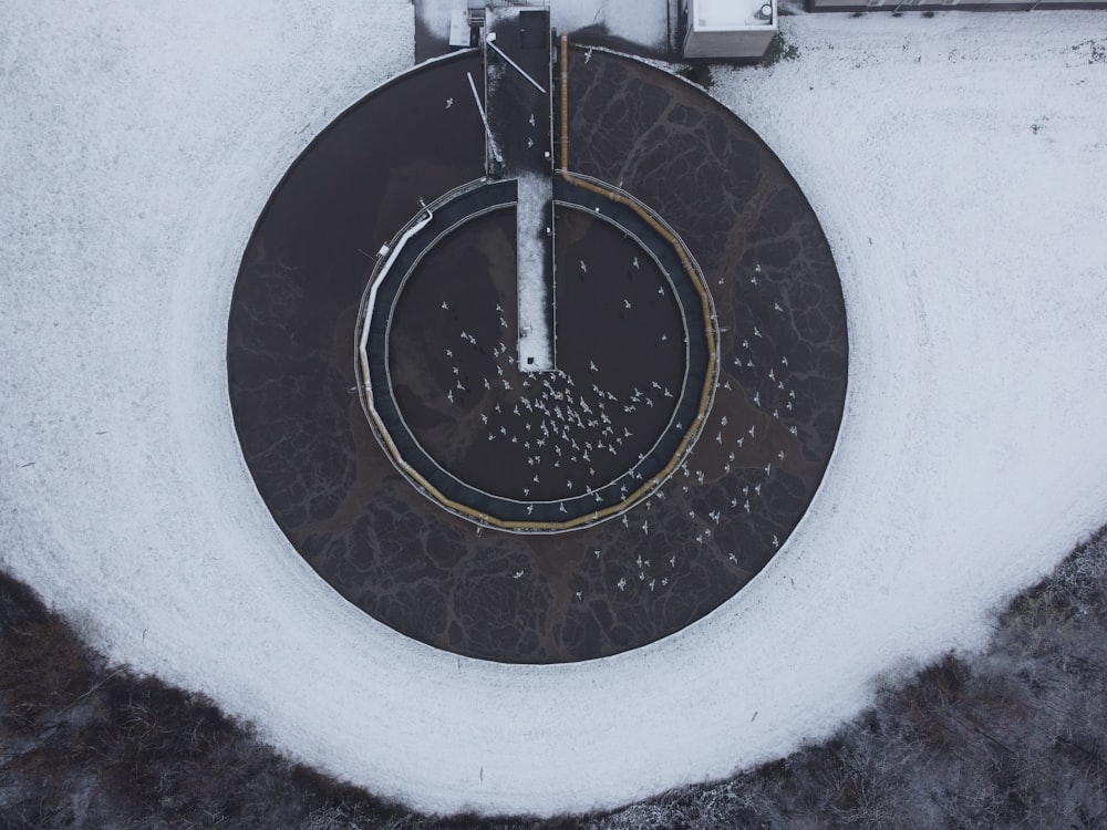 an aerial view of a parking lot covered in snow
