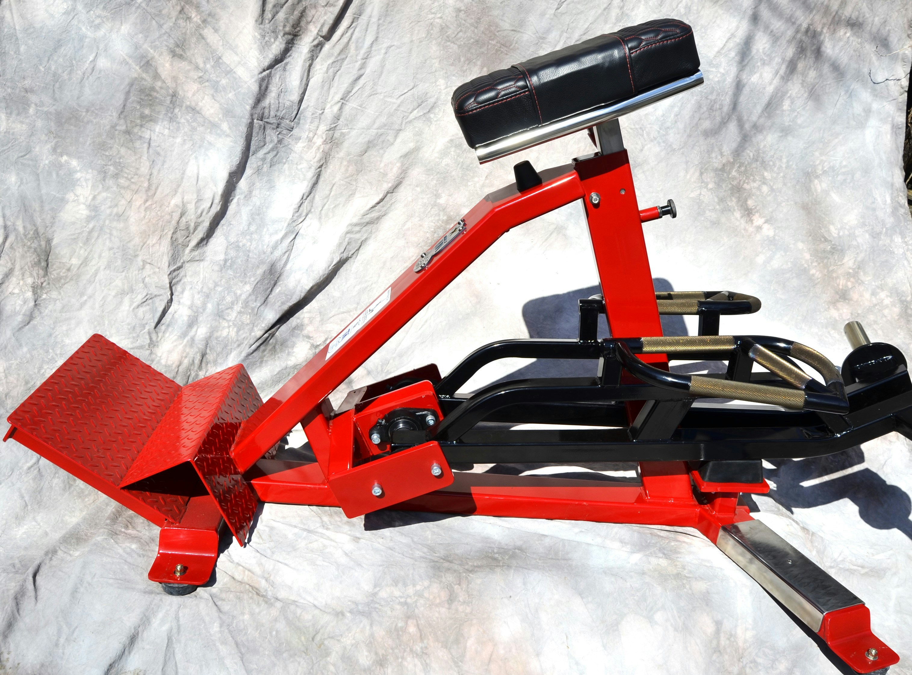 Utility bench with padded seat for various strength training exercises