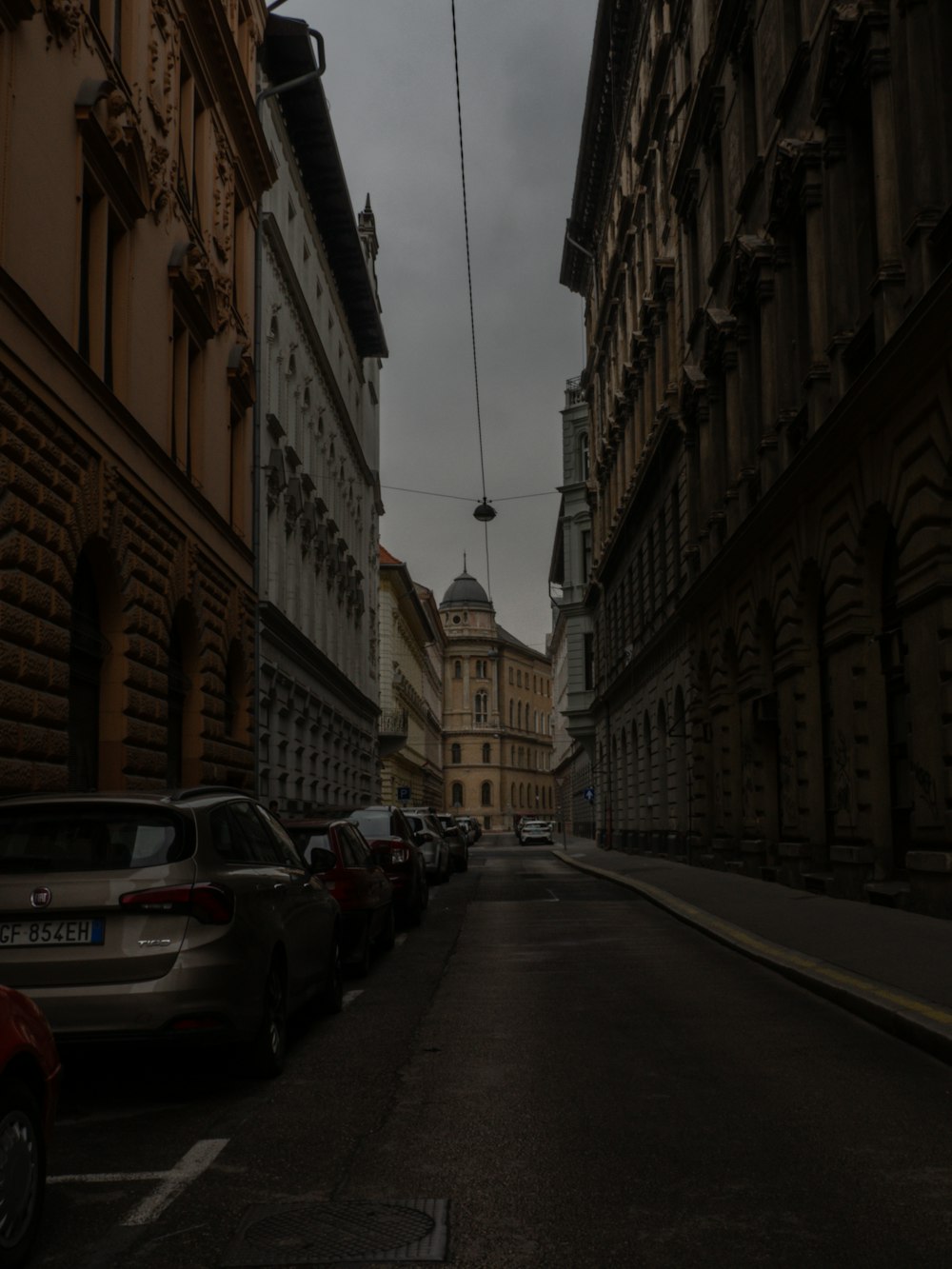 a street with cars parked on both sides of it