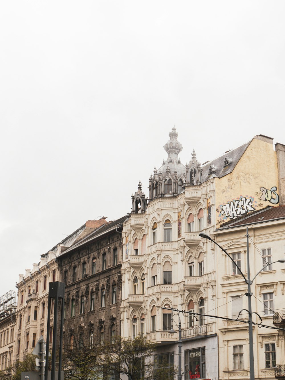 a row of old buildings on a city street