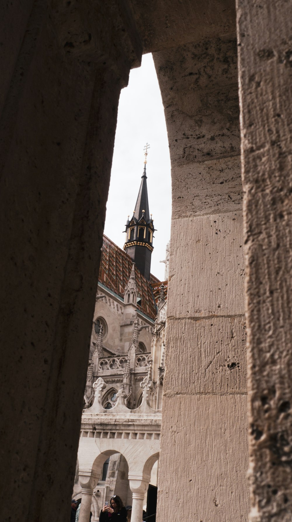 a tall building with a clock tower in the background