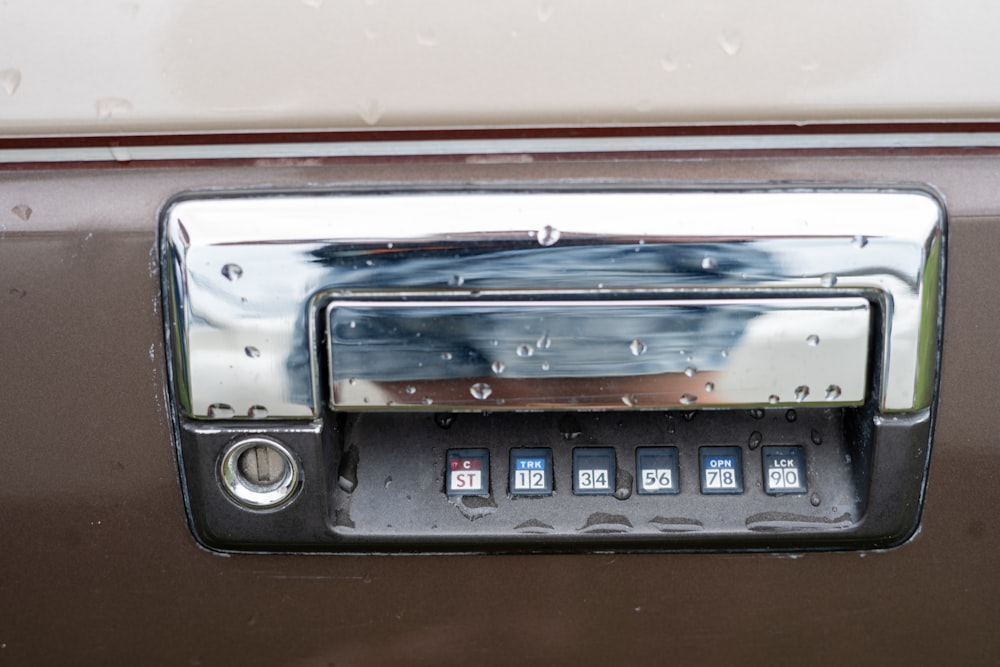 a close up of a radio with rain drops on it
