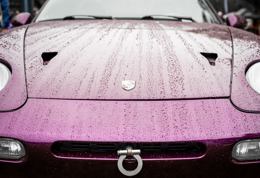a purple sports car parked in a parking lot
