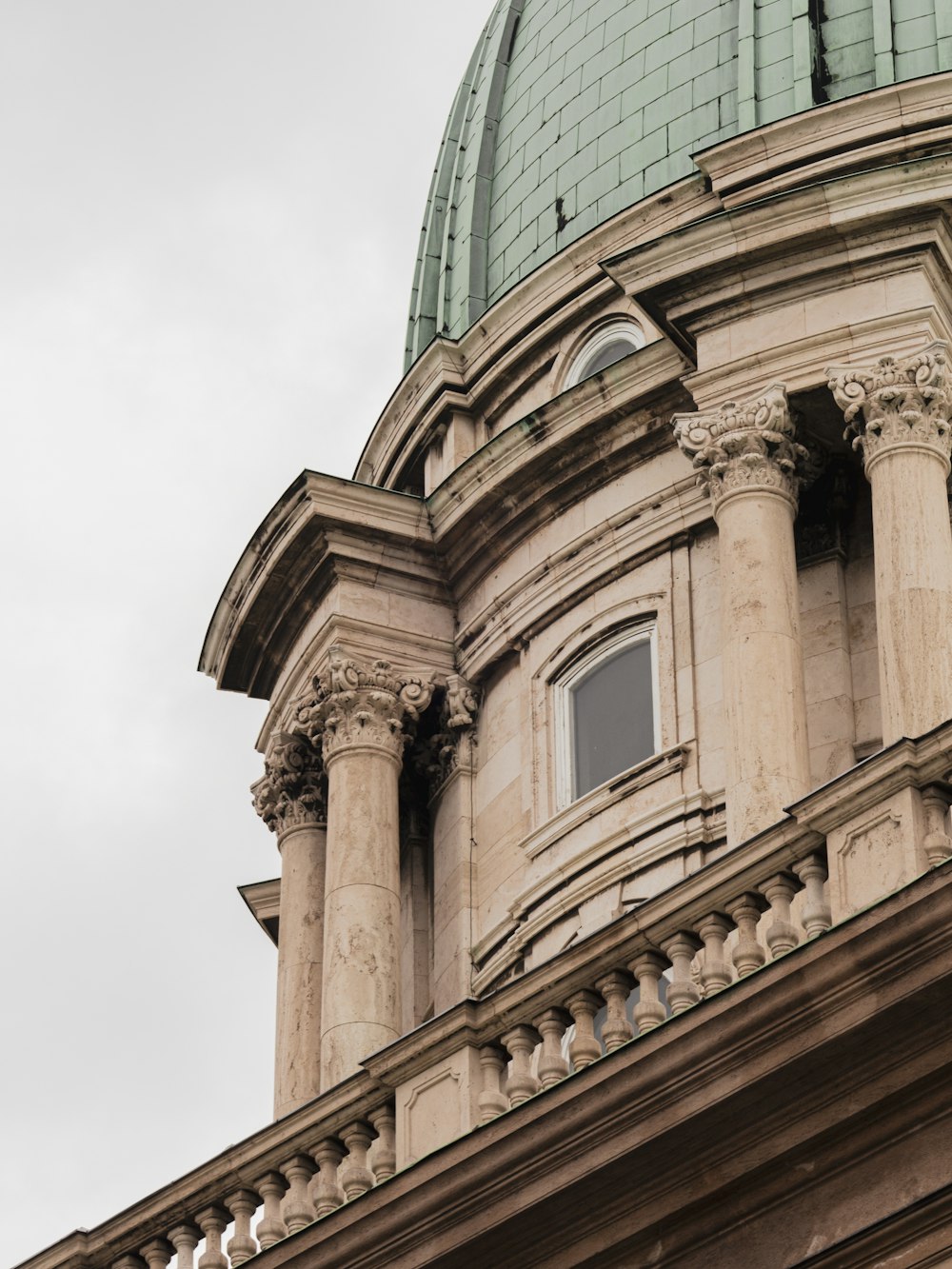 a large building with a green dome on top