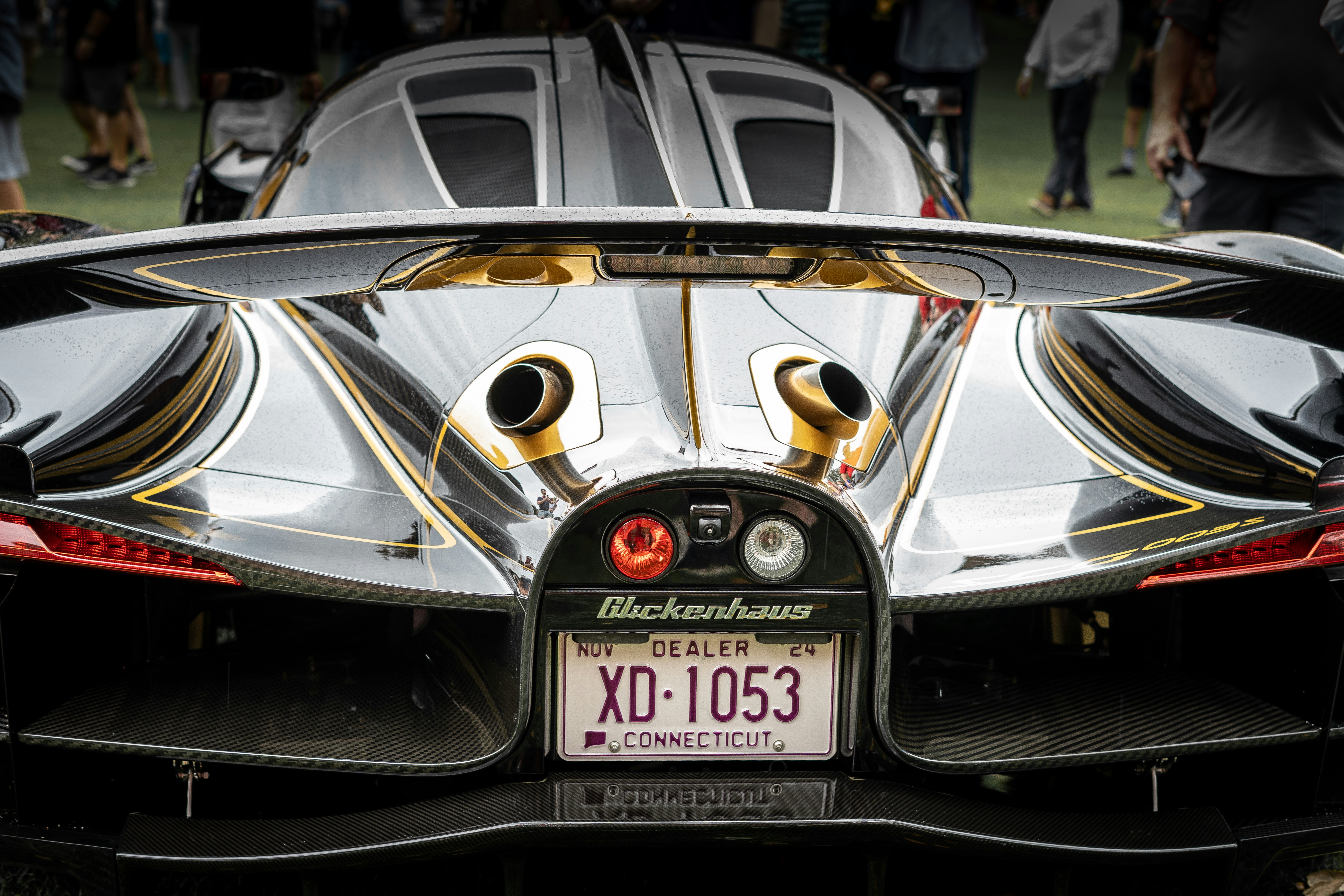 The rear end of a black and gold sports car photo – Free Fl Image on ...