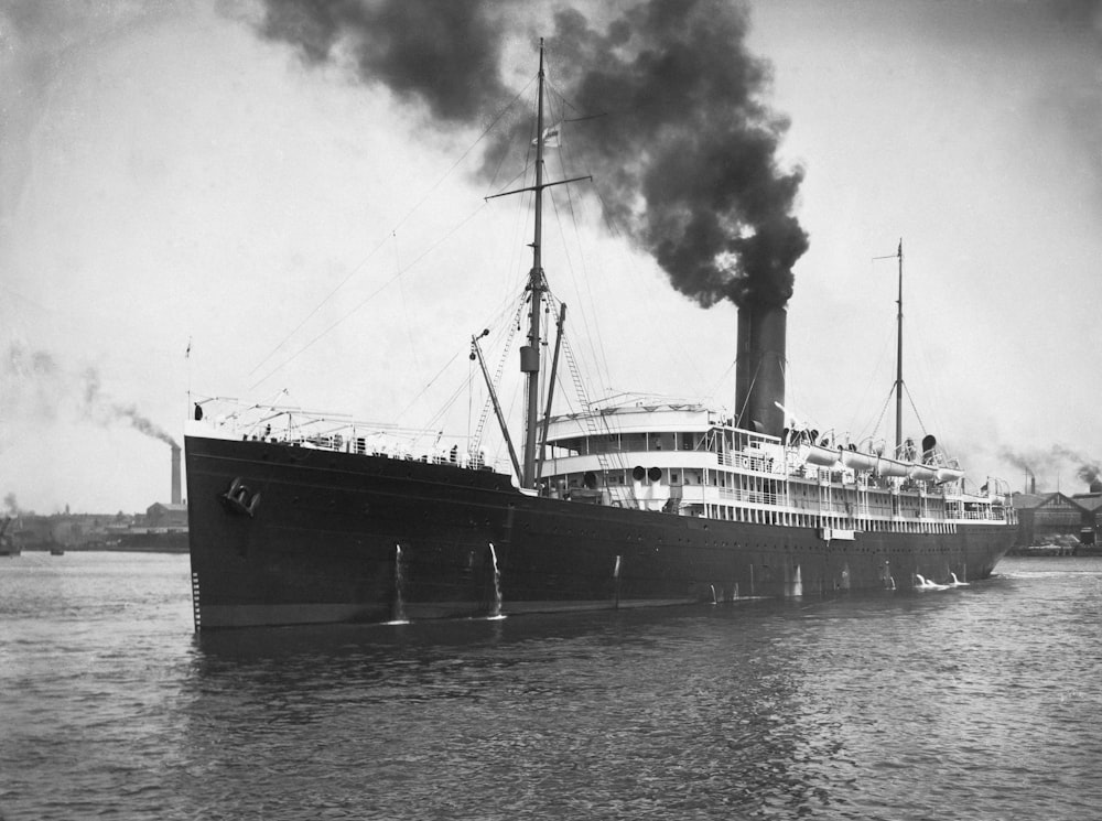 a black and white photo of a large boat in the water