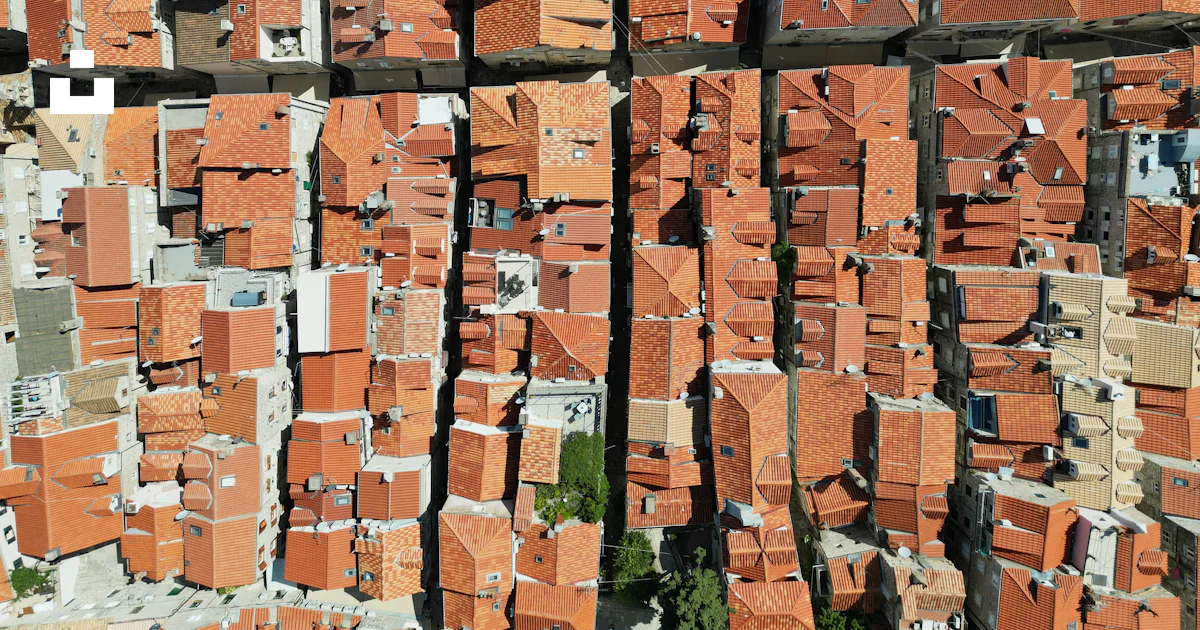 An aerial view of a large group of brick buildings photo – Free ...