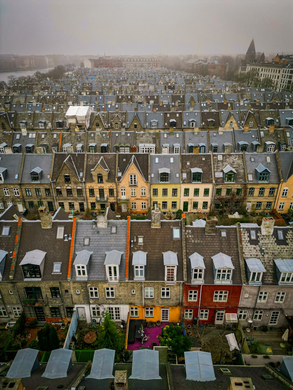 an aerial view of a city with lots of houses