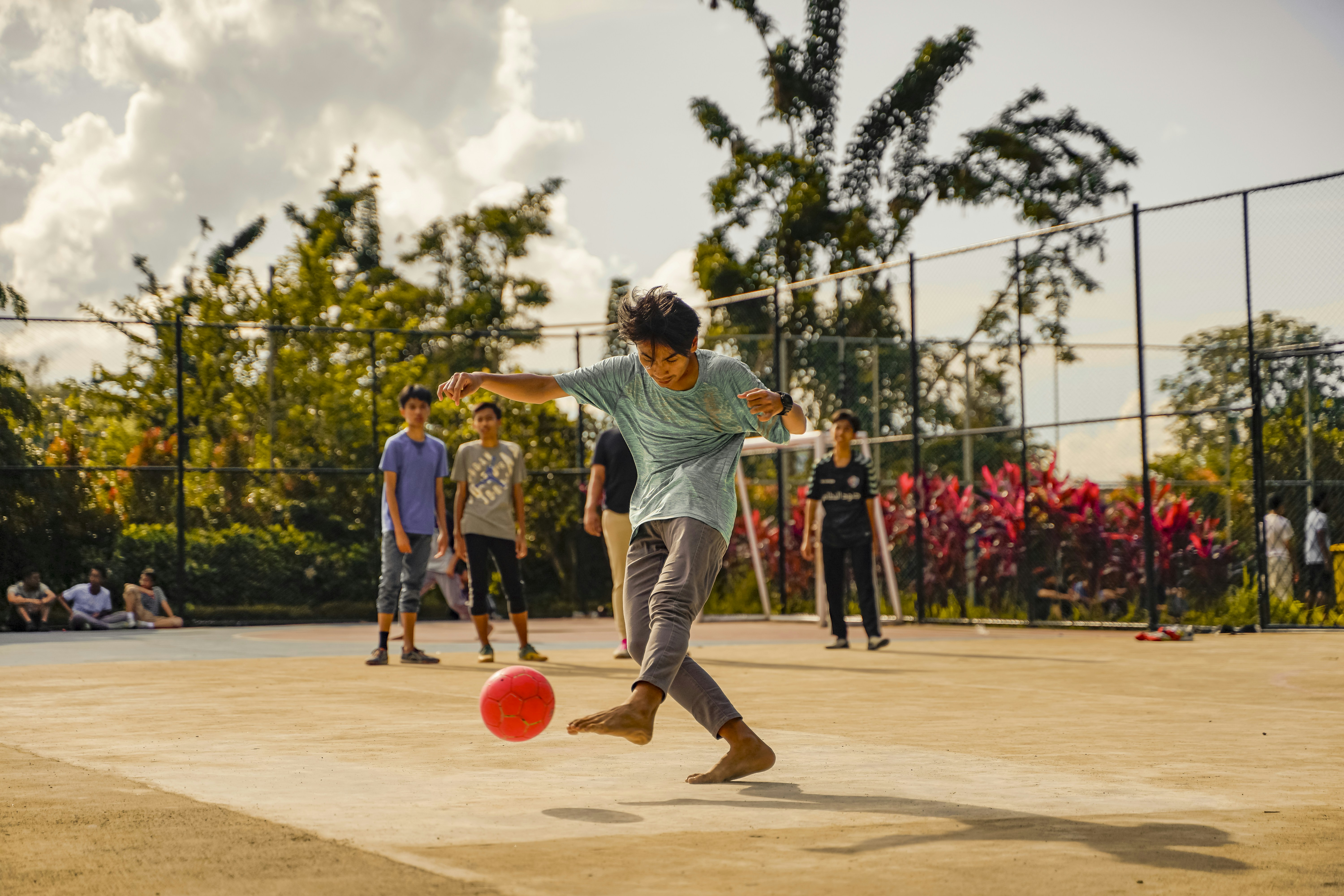 a group of young men playing a game of frisbee