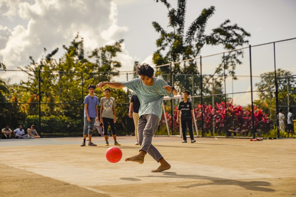 a group of young men playing a game of frisbee