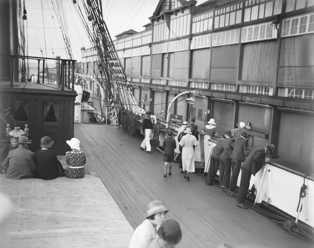 a black and white photo of people on a boat