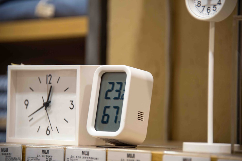 a clock sitting on top of a stack of boxes