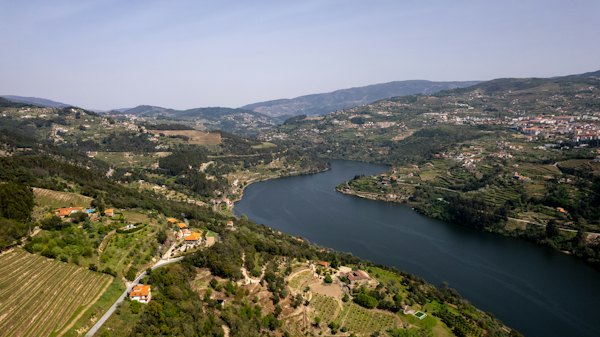A river running through a lush green hillside — Douro Valley, Portugal