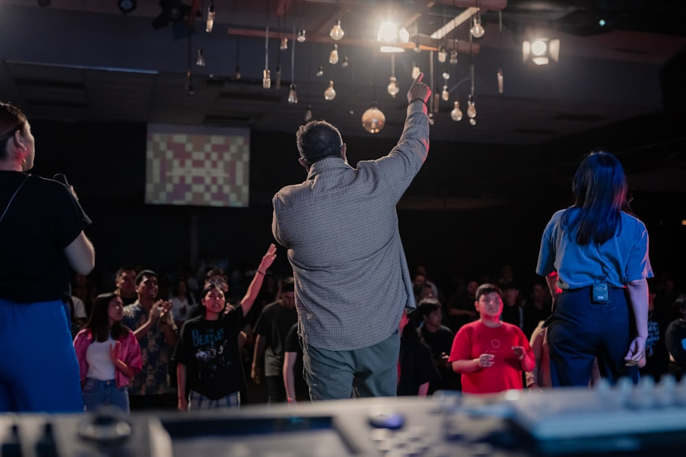 a man standing in front of a crowd of people