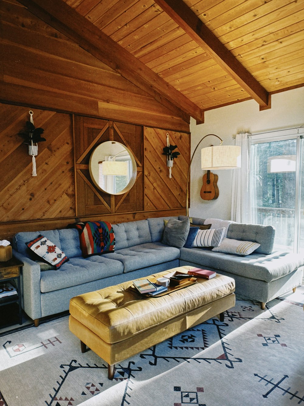 a living room filled with furniture and a large window