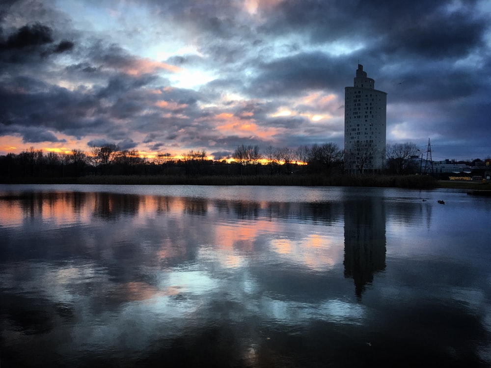 a large body of water under a cloudy sky