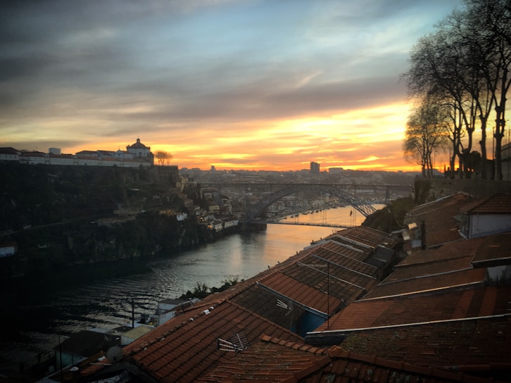 A vibrant sunset over the historic Roman bridge in Mérida, Extremadura.