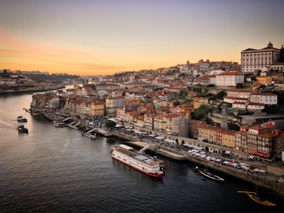 Scenic riverside view of Parque das Nações with modern architecture at sunset.