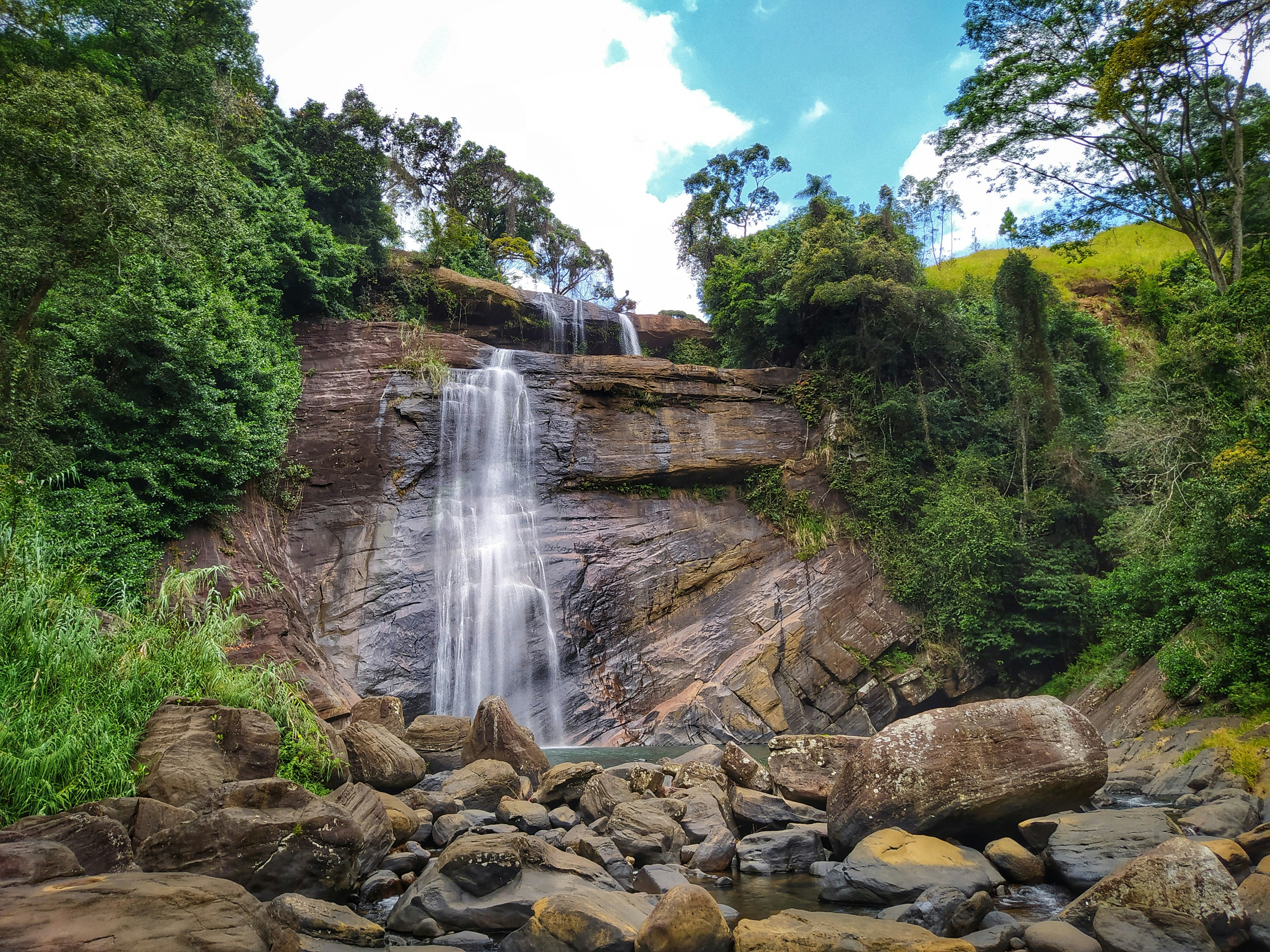 a waterfall with a large amount of water coming out of it, 