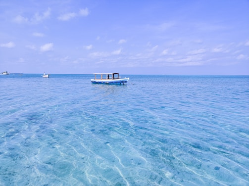 Traveler enjoying a boat ride on crystal clear tropical waters
