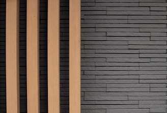 Modern room showcasing sleek PVC louvers paired with natural stone panels.