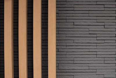 A stylish media wall featuring clean lines, textured panels, and hidden compartments.