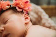 Close-up of a baby headband with a large fabric flower and bow