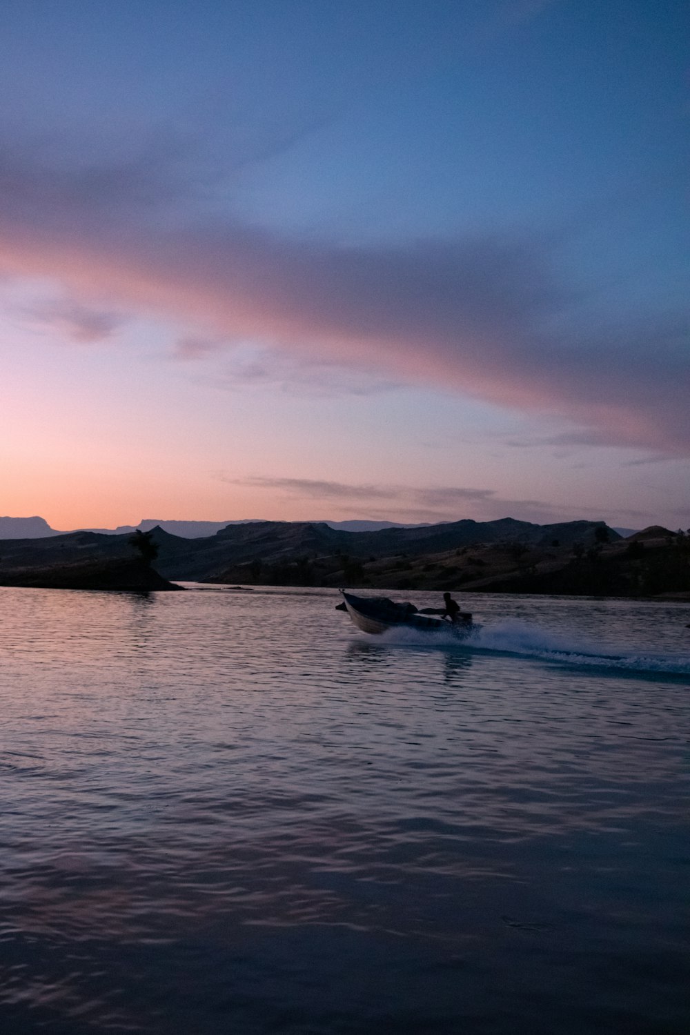 a boat in the water with a sky background