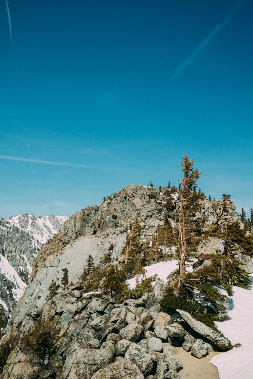 a person on a snowboard on a snowy mountain