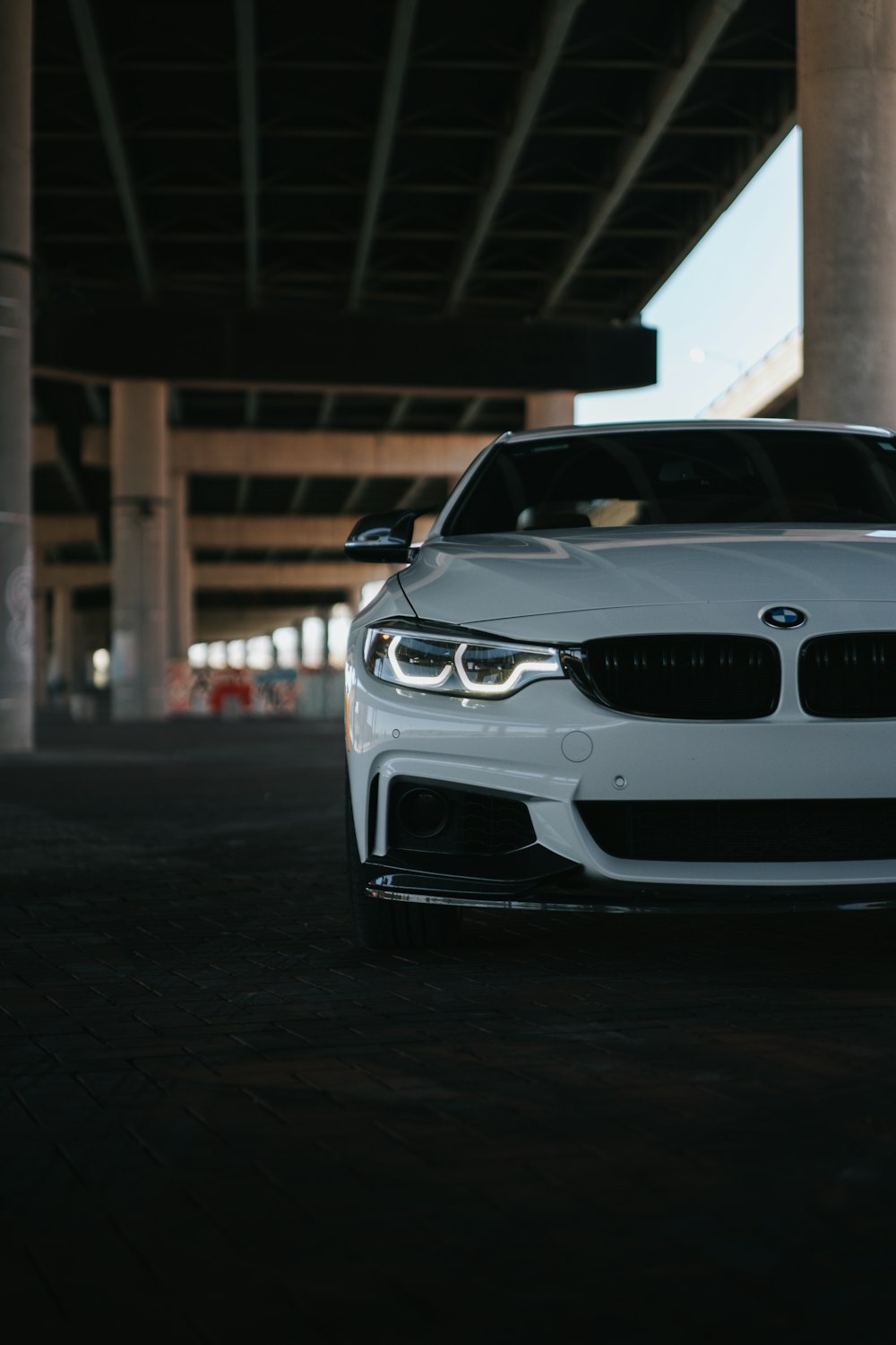 a white car parked in a parking garage