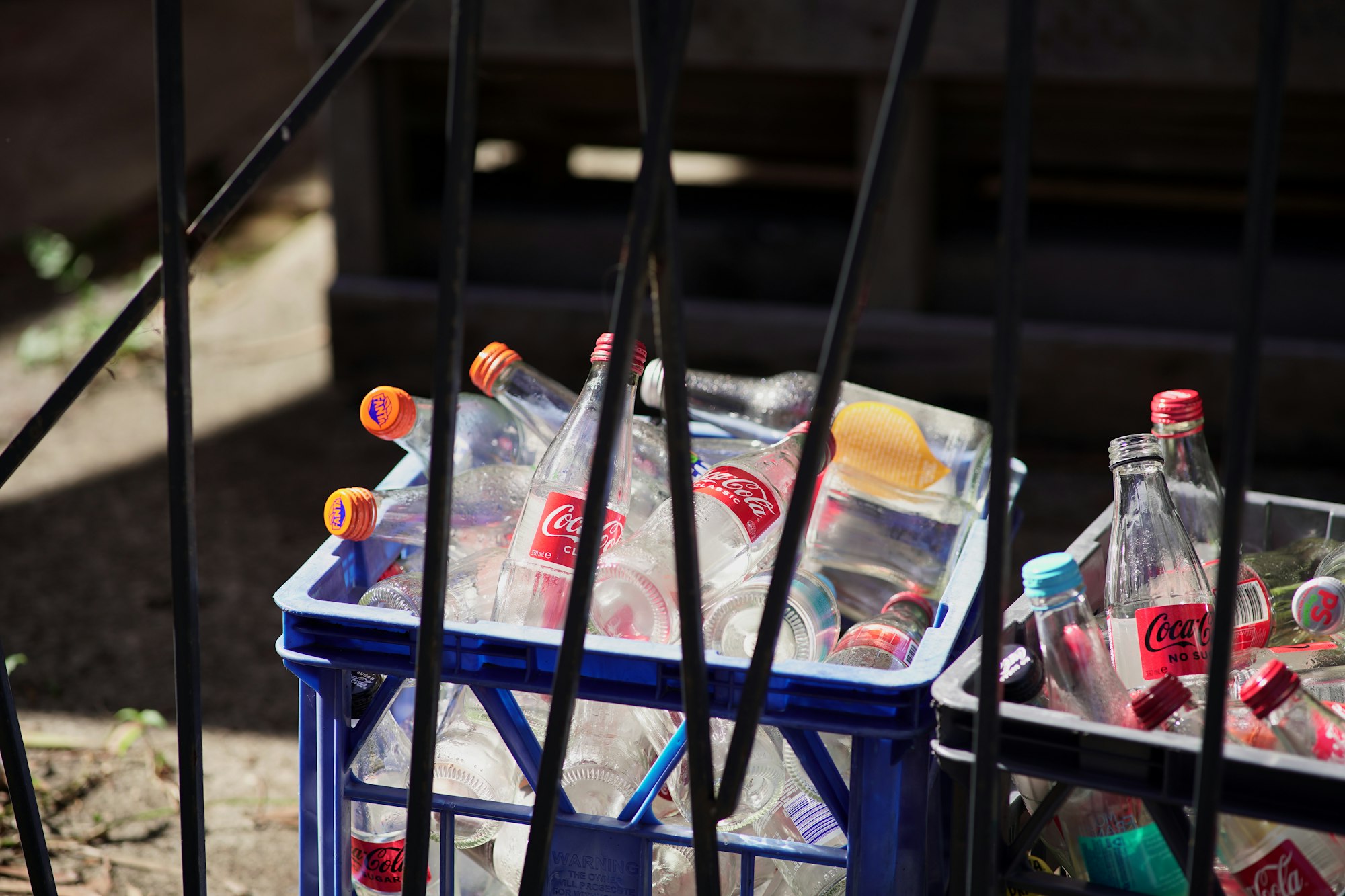 a couple of bins that have some bottles in them