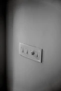 Smart home installation featuring wall-mounted control panels and ambient lighting.