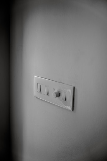 Modern smart home control panel on a wall with soft lighting