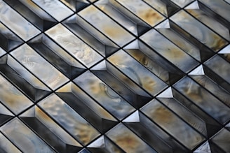 Close-up of glossy ceramic tiles arranged in a modern pattern.