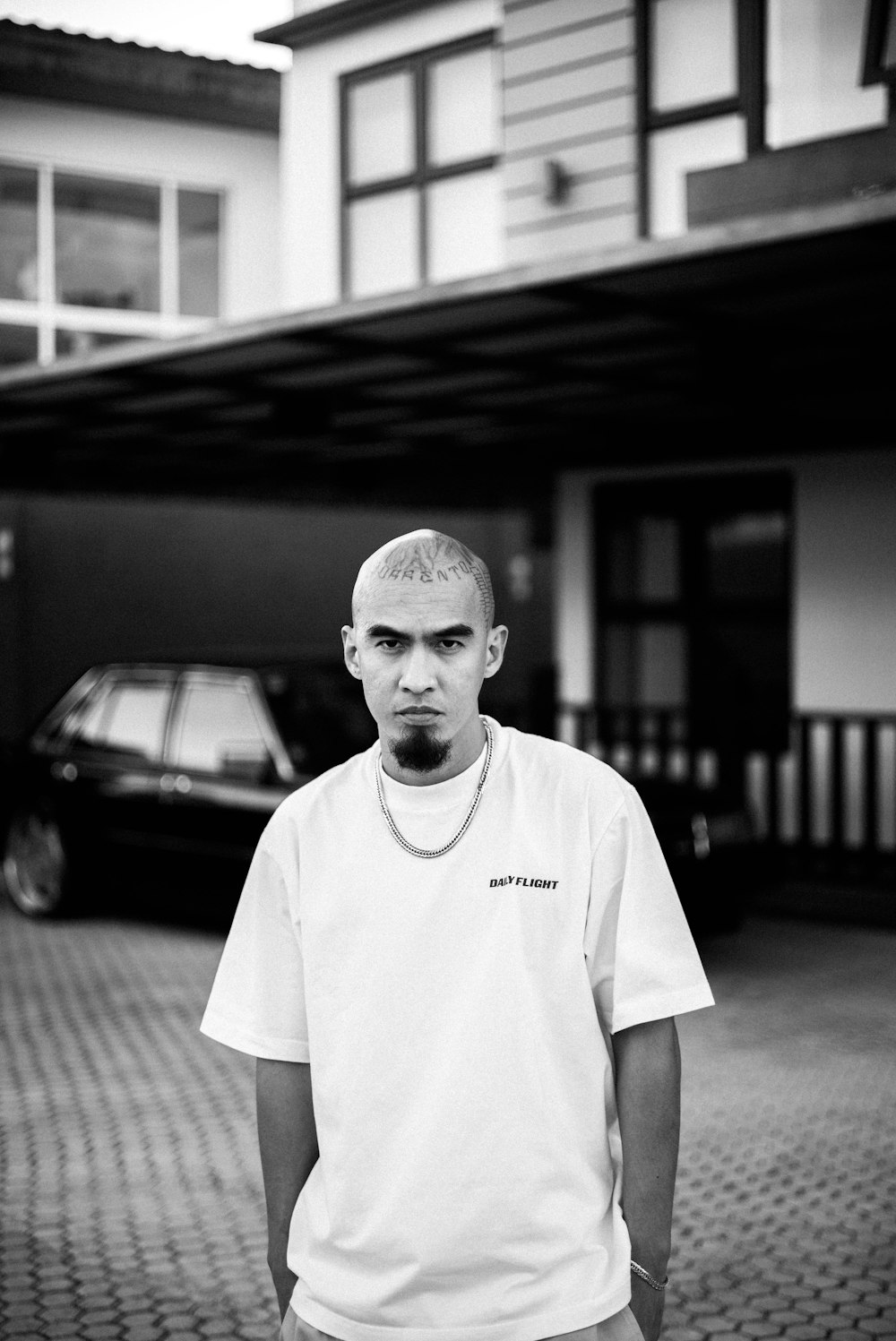 a man standing in front of a building