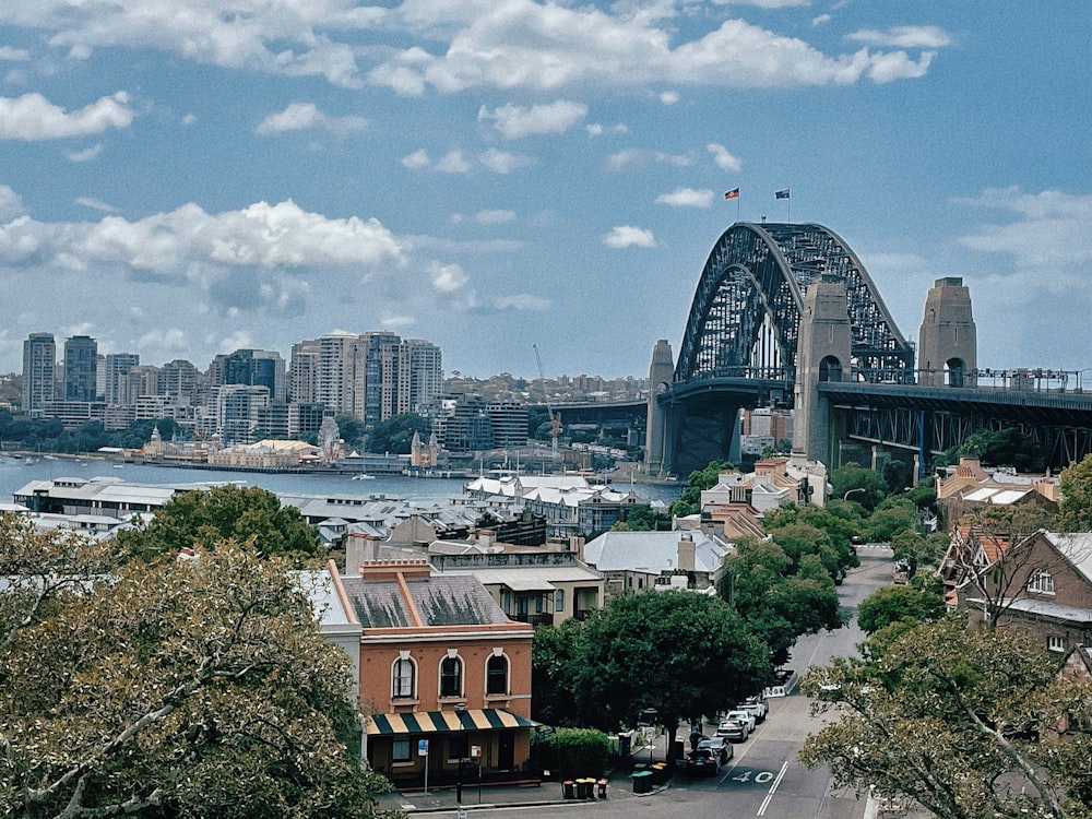 a view of a city with a bridge in the background