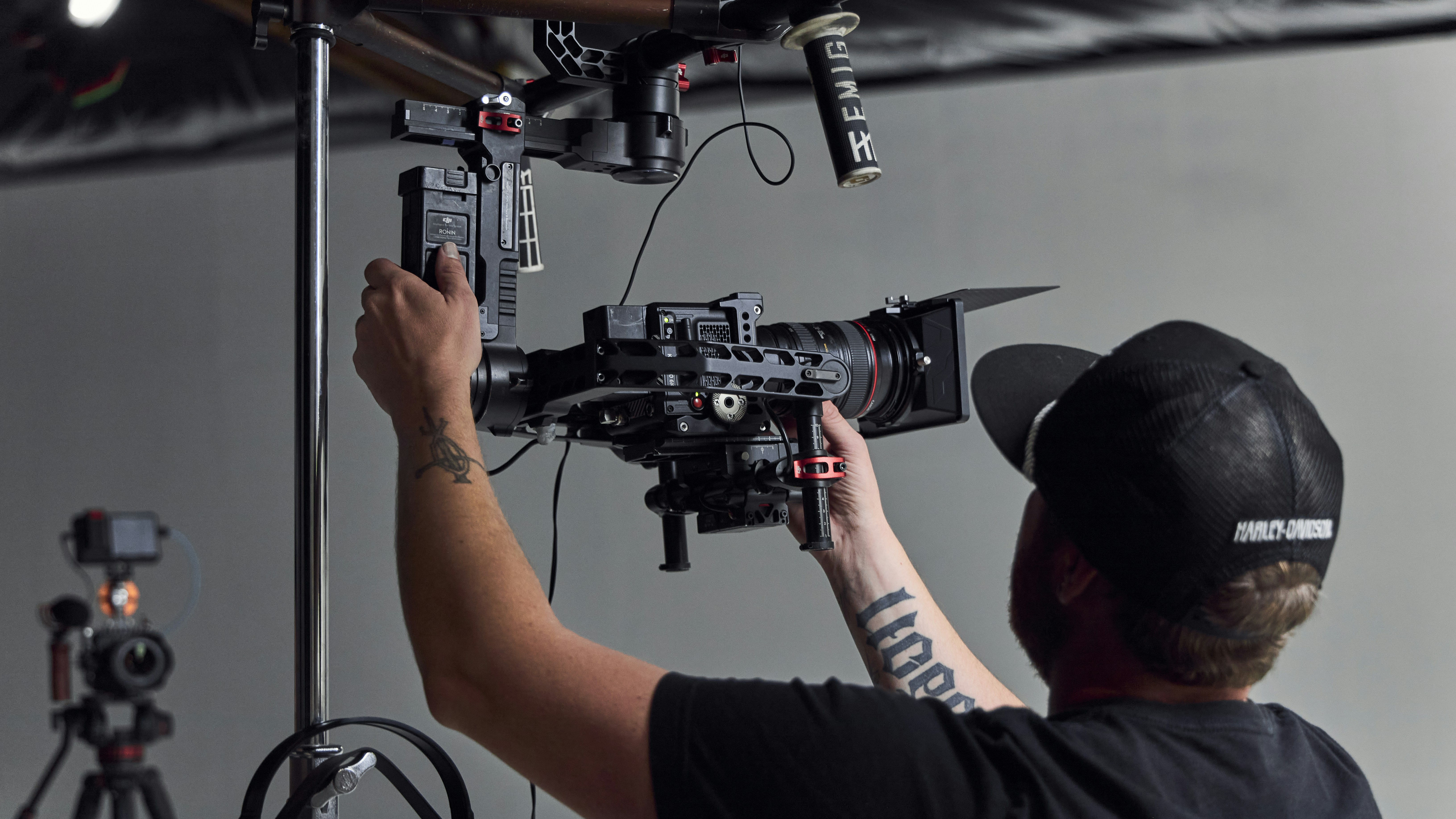 a man holding a camera in front of a camera