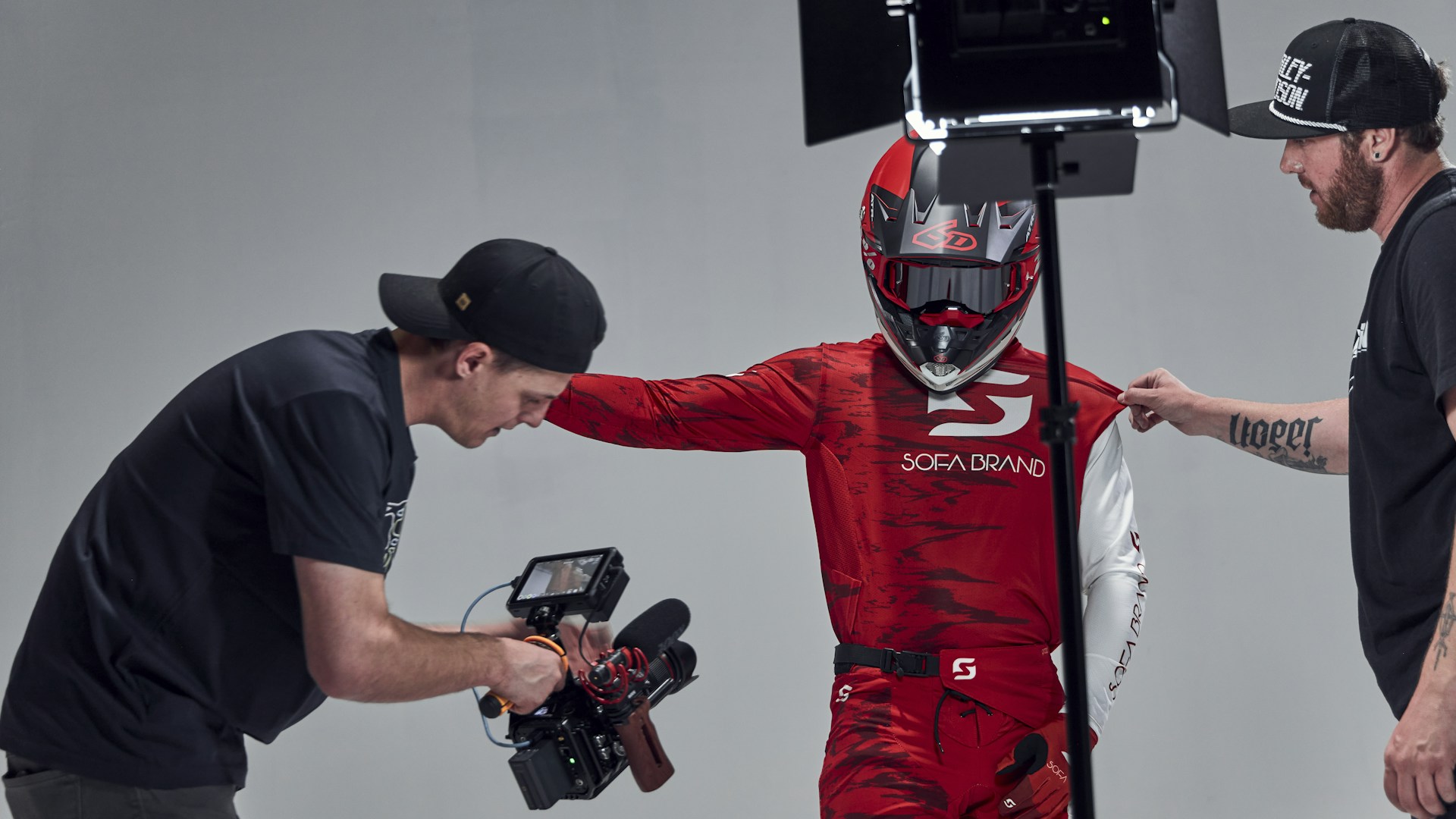 a man in a red suit and a man in a black shirt