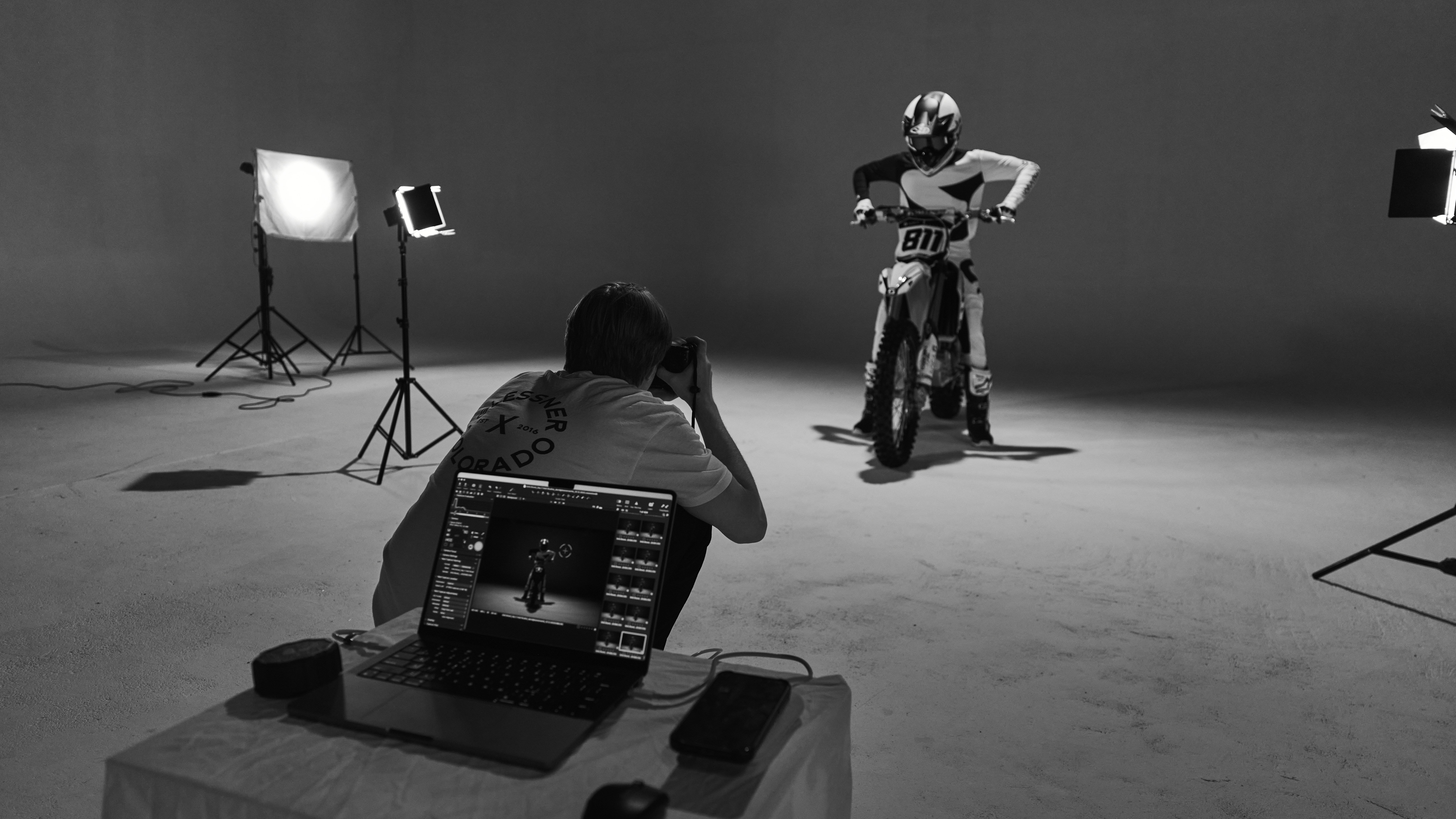 a person sitting on a chair in front of a laptop