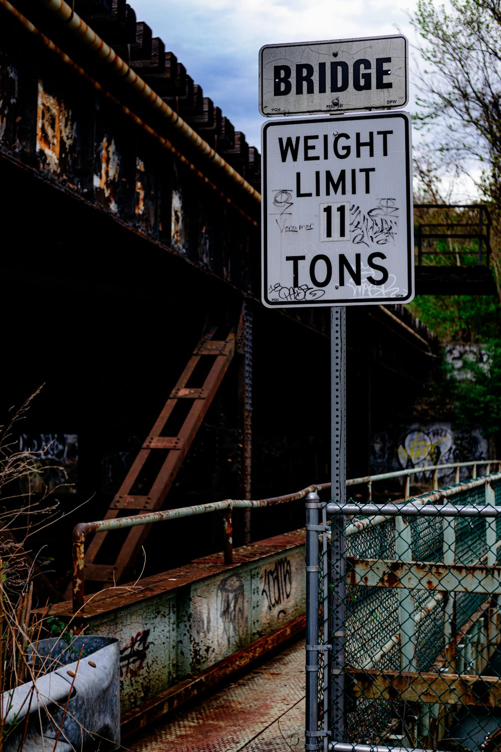 a bridge with a weight limit sign next to it