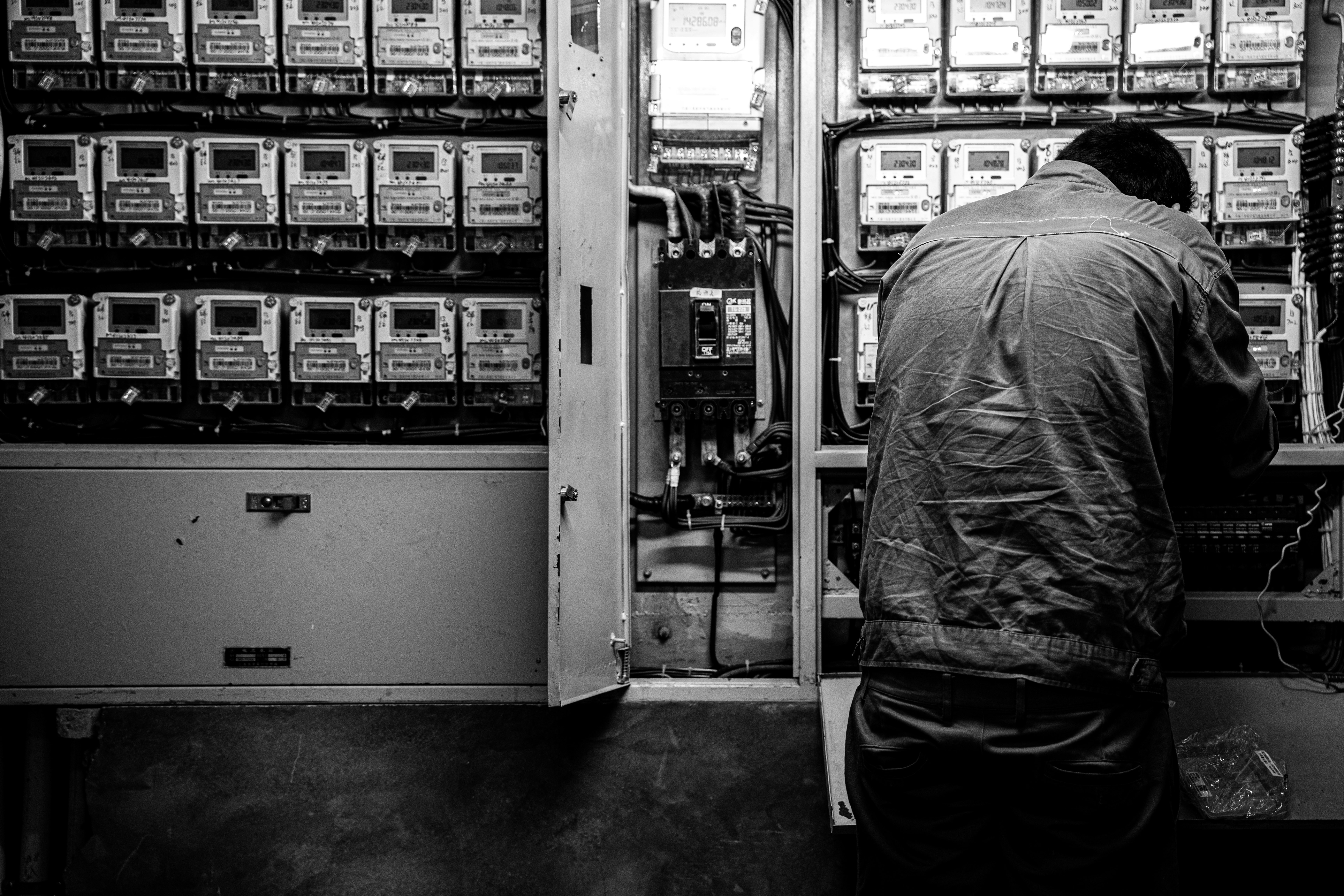 a man standing in front of a machine
