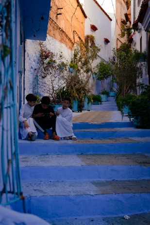 a couple of people sitting on some steps