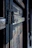 Close-up of tempered glass door hinges showing sturdy hardware and smooth finish.