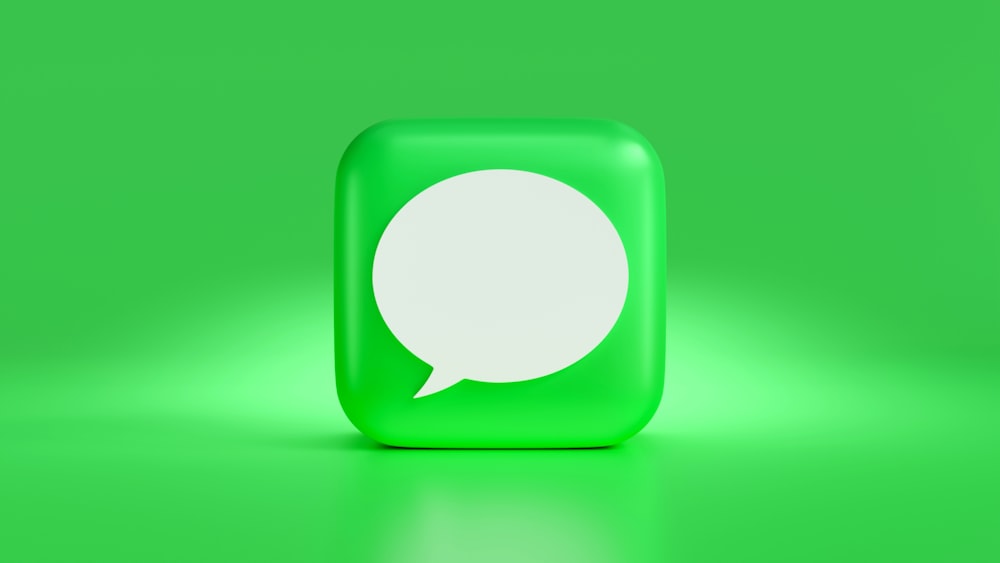 a green square with a white speech bubble