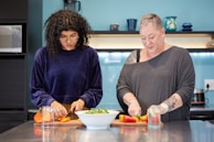 A person preparing a healthy meal in a modern kitchen.