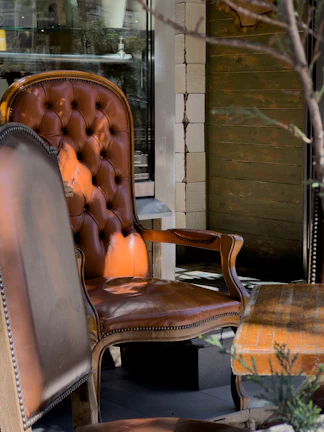 A cozy armchair with a protective waterproof coating being applied by a professional.