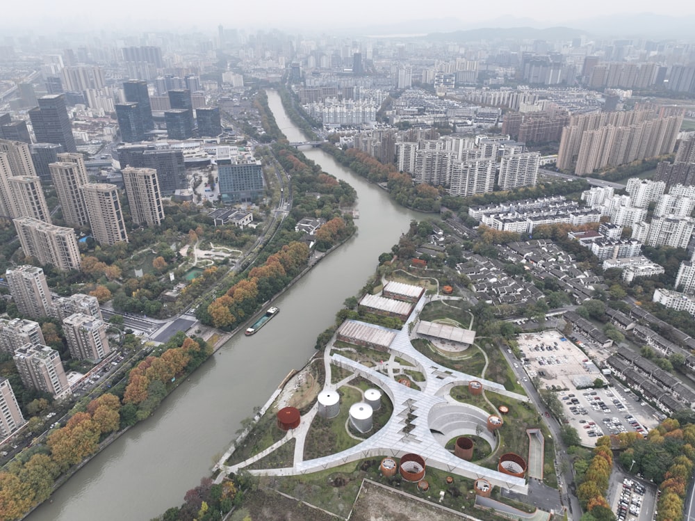 an aerial view of a river running through a city