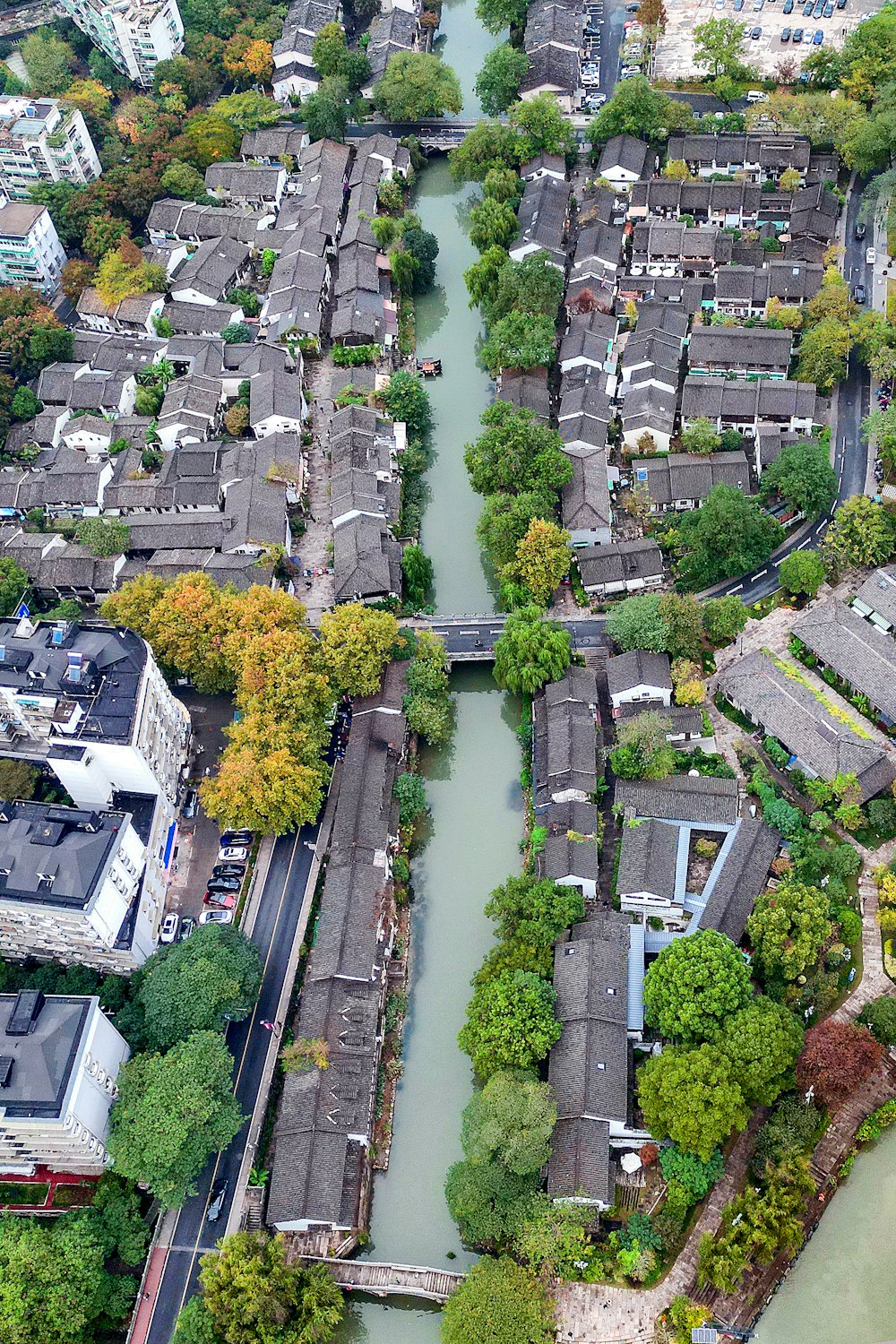 an aerial view of a river running through a city