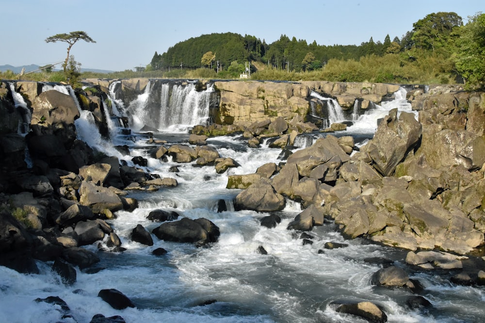 a large waterfall with lots of water coming out of it